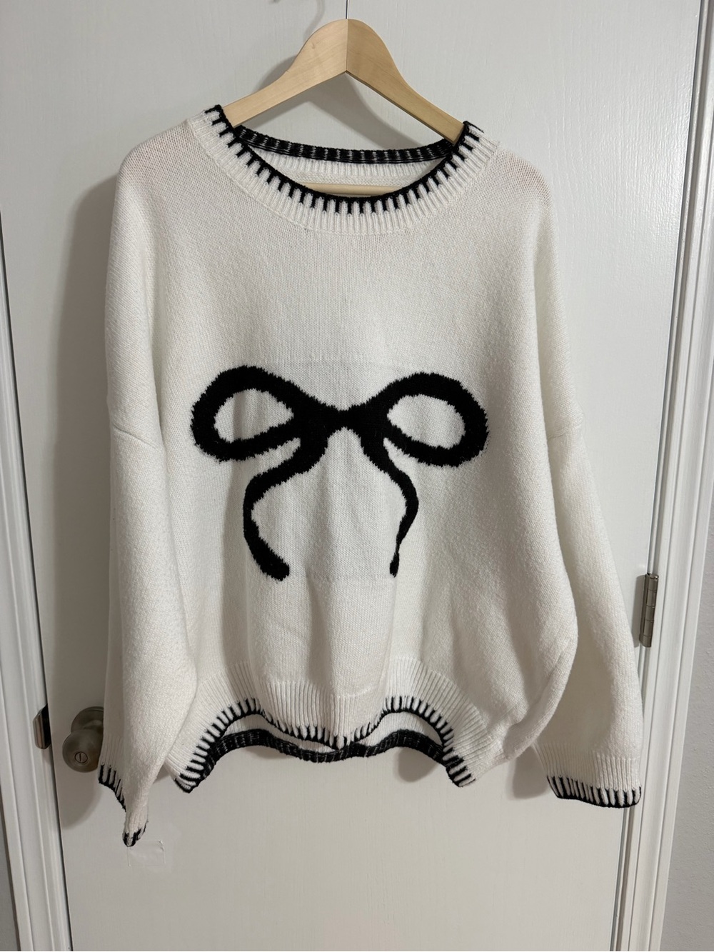 SHEIN White Sweater with Black Bow Accent
